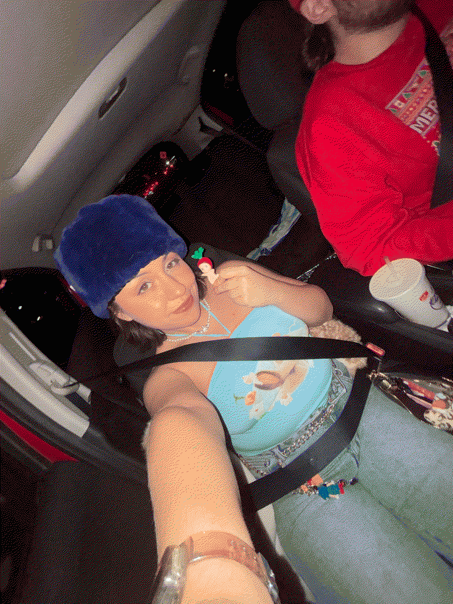 the webmaster holding a sonny angel in the car